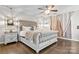 Main bedroom featuring a ceiling fan, hardwood floors, and two windows for natural light at 2522 Richland Balsam Dr # 450, Fort Mill, SC 29715