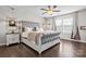 Elegant main bedroom with decorative ceiling fan, hardwood floors, and windows for natural light at 2522 Richland Balsam Dr # 450, Fort Mill, SC 29715