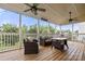 Spacious screened-in porch featuring comfortable seating, a dining table, and string lights for a cozy atmosphere at 2522 Richland Balsam Dr # 450, Fort Mill, SC 29715