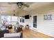 Inviting covered patio with ceiling fans, outdoor furniture, and a TV, perfect for relaxing and entertaining at 2522 Richland Balsam Dr # 450, Fort Mill, SC 29715