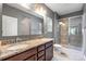 Bathroom featuring double sink vanity with granite countertops and walk-in shower at 3053 Riker St, Clover, SC 29710