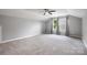 Large carpeted bedroom featuring a ceiling fan, vaulted ceiling, and natural light from two windows at 3053 Riker St, Clover, SC 29710