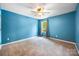 Large bedroom with plush carpeting, a ceiling fan and an abundance of natural light at 3053 Riker St, Clover, SC 29710