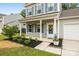 Inviting front porch with decorative plants and 'Welcome' sign, enhancing curb appeal at 3053 Riker St, Clover, SC 29710