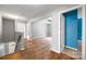 Hardwood hallway with a staircase leading downstairs and a glimpse of a blue accent wall at 3053 Riker St, Clover, SC 29710