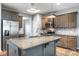 Kitchen featuring granite countertops, stainless steel appliances and fixtures, beautiful wood cabinets, and a center island at 3053 Riker St, Clover, SC 29710