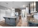 Kitchen with granite countertops, center island with sink and stainless steel appliances, and an open-concept design at 3053 Riker St, Clover, SC 29710