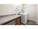 Practical laundry room with modern washer and dryer, featuring ample counter space at 3053 Riker St, Clover, SC 29710