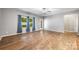 Living room featuring wood floors, natural light through windows, and a neutral color palette at 3053 Riker St, Clover, SC 29710