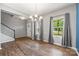Spacious living room with hardwood floors, natural light, and staircase access, perfect for entertaining at 3053 Riker St, Clover, SC 29710