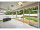 Covered screened porch overlooking a manicured backyard with privacy fence and mature trees at 3053 Riker St, Clover, SC 29710