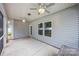 Covered porch featuring gray siding and ceiling fans for added comfort at 3053 Riker St, Clover, SC 29710