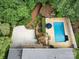 Aerial view of a backyard featuring a pool, deck, patio, walkway, and a garden at 3225 Mill Pond Rd, Charlotte, NC 28226