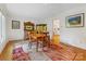 Elegant dining room with hardwood floors, a vintage buffet, and bright lighting at 3225 Mill Pond Rd, Charlotte, NC 28226