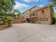 Stately brick home with a multi-car garage and spacious driveway awaits its new owners at 3225 Mill Pond Rd, Charlotte, NC 28226