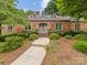 Charming brick home with well-manicured landscaping and a welcoming front entrance at 3225 Mill Pond Rd, Charlotte, NC 28226