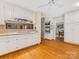 Spacious kitchen showcasing hardwood floors, ample cabinet space, and modern built-in appliances at 3225 Mill Pond Rd, Charlotte, NC 28226