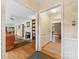 Open-concept living spaces with hardwood floors and a view into the Gathering room at 3225 Mill Pond Rd, Charlotte, NC 28226