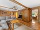 Comfortable living room featuring hardwood floors, a fireplace, and built-in bookshelves at 3225 Mill Pond Rd, Charlotte, NC 28226