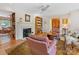 Inviting living room with a fireplace, built-in shelves, and hardwood floors at 3225 Mill Pond Rd, Charlotte, NC 28226