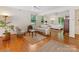 Open floor plan with wood floors connecting the living and bedroom areas at 3225 Mill Pond Rd, Charlotte, NC 28226