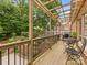 Outdoor patio with a pergola overlooking a beautifully landscaped yard at 3225 Mill Pond Rd, Charlotte, NC 28226