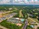 Aerial view of community amenities, including tennis courts, a swimming pool, and lush landscaping at 3248 Lake Shore S Rd, Denver, NC 28037