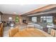 Large basement featuring a bar, fireplace, water views, exposed beams, and brick accents at 3248 Lake Shore S Rd, Denver, NC 28037