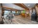 Spacious basement with wood floors, brick accents, bar, pool table, and beautiful lake views at 3248 Lake Shore S Rd, Denver, NC 28037