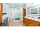 Modern bathroom features an updated vanity, walk-in shower, and unique tile flooring at 3248 Lake Shore S Rd, Denver, NC 28037
