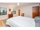 Bright bedroom with hardwood floors and natural light features a light color scheme at 3248 Lake Shore S Rd, Denver, NC 28037