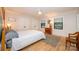 Bright bedroom features hardwood floors, ceiling fan, and large windows offering natural light at 3248 Lake Shore S Rd, Denver, NC 28037