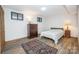 Bedroom with natural light, wood floors, classic accents, and ample closet space at 3248 Lake Shore S Rd, Denver, NC 28037