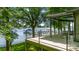 Stunning lake view from the deck, featuring modern railings and ample seating space at 3248 Lake Shore S Rd, Denver, NC 28037