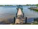 Scenic view from the dock out onto the serene lake with a boat shelter at 3248 Lake Shore S Rd, Denver, NC 28037