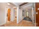Inviting entryway with hardwood floors, modern lighting, and stylish interior doors at 3248 Lake Shore S Rd, Denver, NC 28037