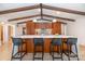 Stylish kitchen island with bar seating and modern lighting, complemented by sleek cabinetry at 3248 Lake Shore S Rd, Denver, NC 28037