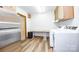 Laundry room with stainless steel refrigerator and modern washer and dryer units at 3248 Lake Shore S Rd, Denver, NC 28037