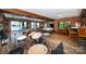 Bright living room overlooking the water features a pool table and drum set at 3248 Lake Shore S Rd, Denver, NC 28037