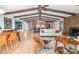 Bright living room with hardwood floors, exposed beams, fireplace and open to modern kitchen at 3248 Lake Shore S Rd, Denver, NC 28037