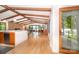 Open-concept living room and dining area featuring hardwood floors and lake views at 3248 Lake Shore S Rd, Denver, NC 28037