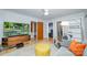 Comfortable living room with light colored carpet, a TV, and a large window at 3248 Lake Shore S Rd, Denver, NC 28037