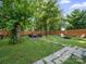Large fenced backyard with seating area and mature shade trees at 339 Arnold St, Rock Hill, SC 29730