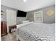The primary bedroom features a large television mounted on the gray walls at 339 Arnold St, Rock Hill, SC 29730