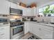 Close-up of modern kitchen appliances, ample counter space, and bright white cabinets at 339 Arnold St, Rock Hill, SC 29730