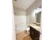 This bathroom is equipped with a shower and tub combination and a granite vanity at 3430 Fincher Blvd, Charlotte, NC 28269