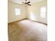 Bedroom with neutral walls, ceiling fan and carpet at 3430 Fincher Blvd, Charlotte, NC 28269