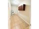 Functional laundry room with tile flooring, a water heater, storage cabinets, and convenient accessibility at 3430 Fincher Blvd, Charlotte, NC 28269
