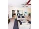 Bright living room featuring neutral walls, carpet flooring, a ceiling fan, and easy access to the kitchen at 3430 Fincher Blvd, Charlotte, NC 28269
