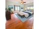 Comfortable bedroom boasts beautiful decor, ceiling fan, and natural light from multiple windows at 3430 Fincher Blvd, Charlotte, NC 28269